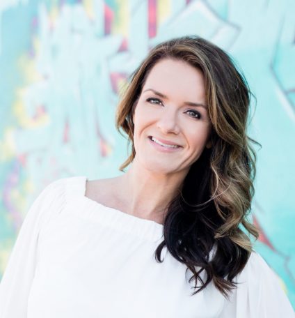 Eva-50-headshot-closeup-943x1024