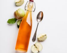 Apple cider vinegar and fresh apples, flat lay, space for your t